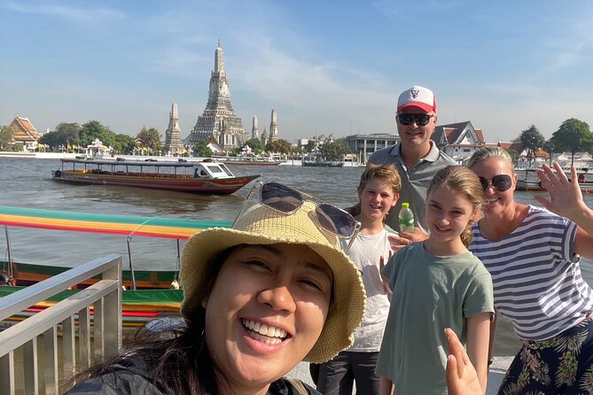 Bangkok Canal Tour: 2-Hour Longtail Boat Ride - Before the canals: Wat Arun glimpses on the Chao Phraya crossing