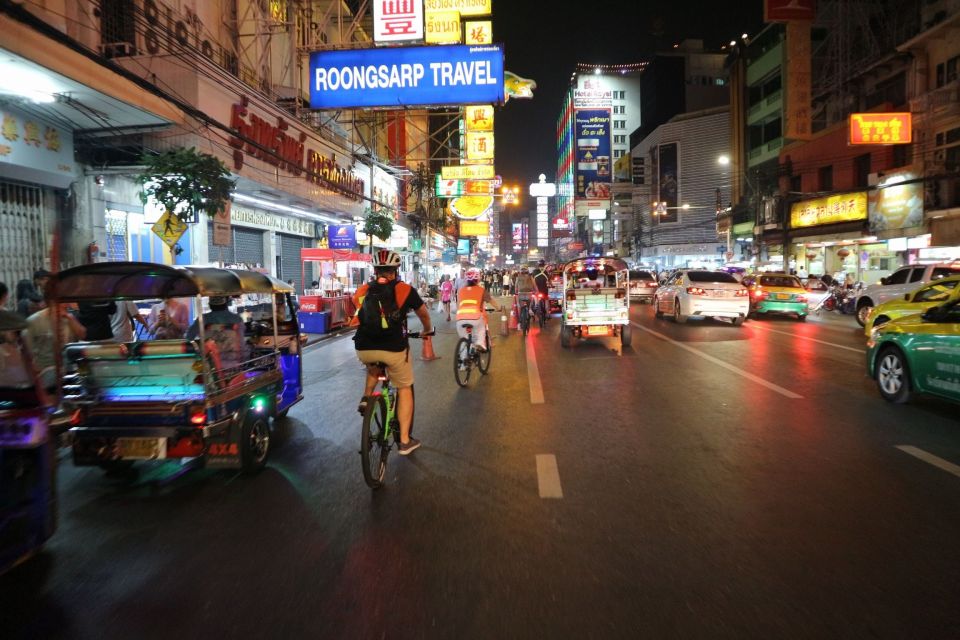Bangkok: Night Bike Ride and Dinner at a Local Restaurant - Chinatown after dark: neon, alley-side street food atmosphere