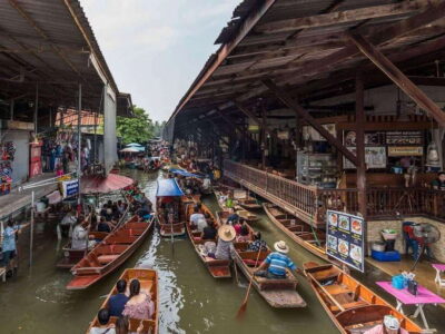 Bangkok: Railway and Floating Market Tour with Dragon Temple - Damnoen Saduak Floating Market: A canal ride that feels more local