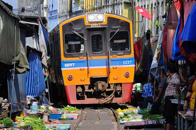 Floating Market Damnoen Saduak and Meklong Railway Market: Half Day Tour - Stop 1: Maeklong Railway Market (Hoop Rom Market) and the “train moment”