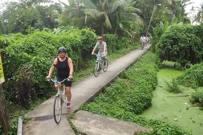 Half-Day Bangkok Bike Tour Including Lunch - Taling Chan floating market: a weekend-only treat