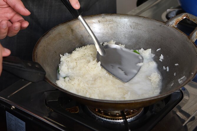 Hands-on Thai Cooking Class & Market Tour in Sukhumvit - In the kitchen: coconut milk, curry paste, chopping, pounding, and sizzling